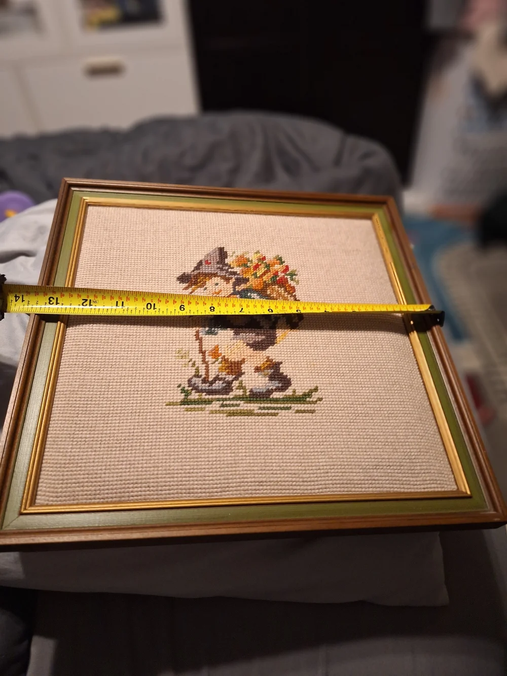 a pair of vintage Hummel framed needlepoint pictures featuring a boy a Girl